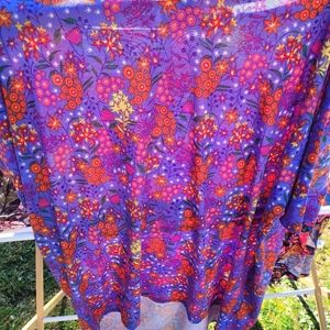 Beautiful EUC Irma Orange and Pink Flowers on a Purple Background